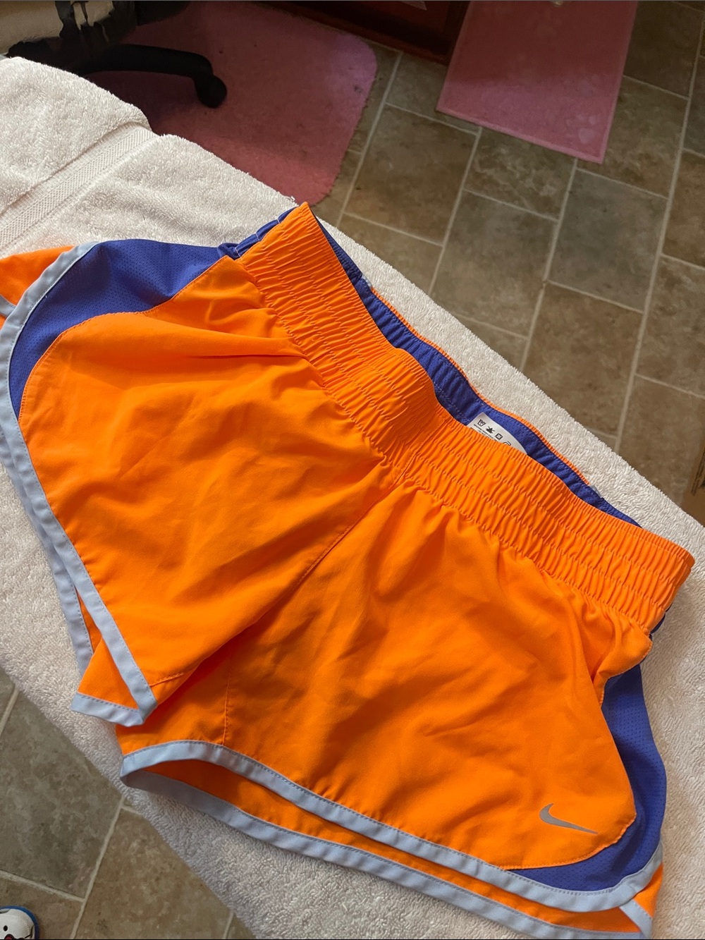 Nike Women’s Orange Athletic Running Shorts with Blue Accents